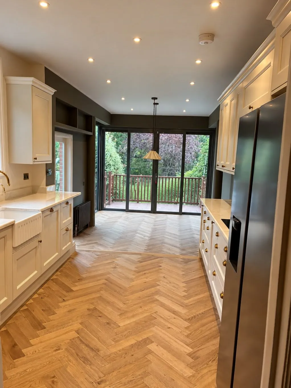 Herringbone oak flooring installed in a long galley kitchen | Northfold Flooring