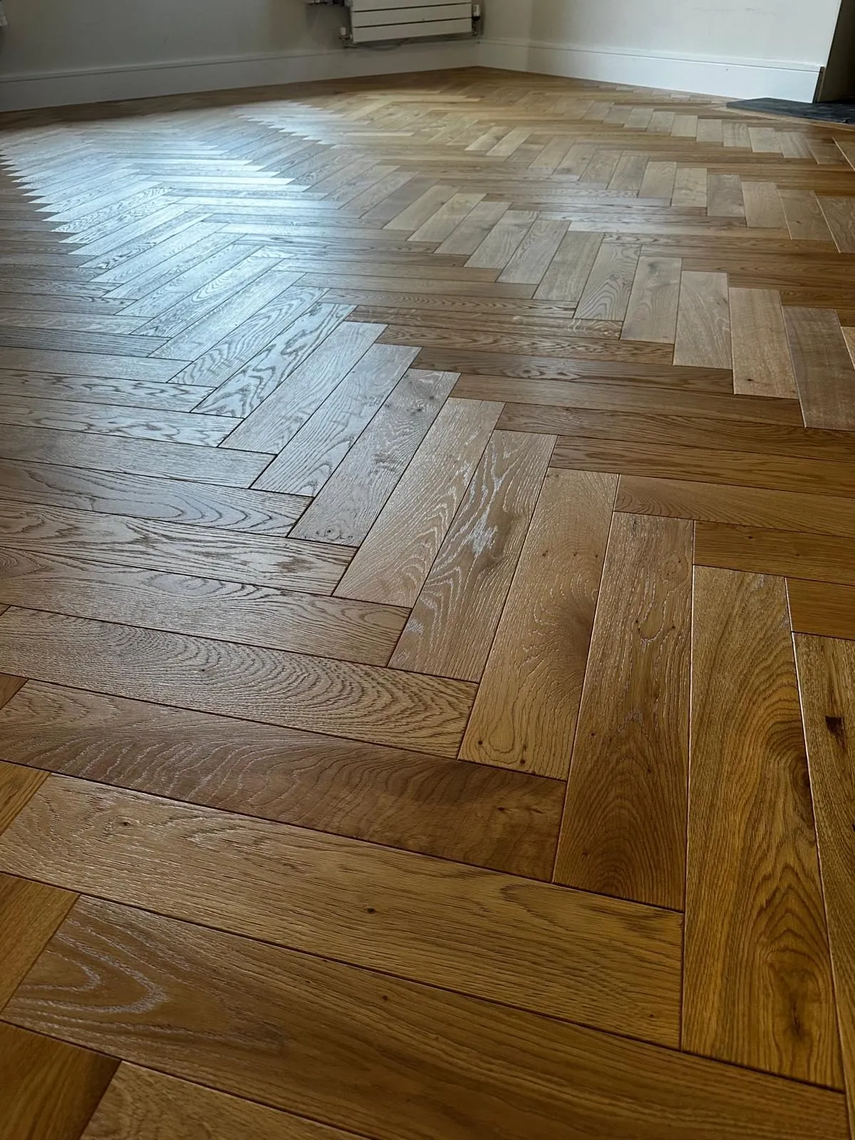 Close-up of a newly installed herringbone oak floor | Northfold Flooring