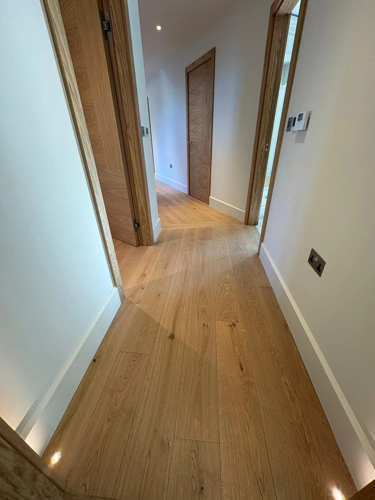 Engineered oak plank flooring fitted along a long landing | Northfold Flooring