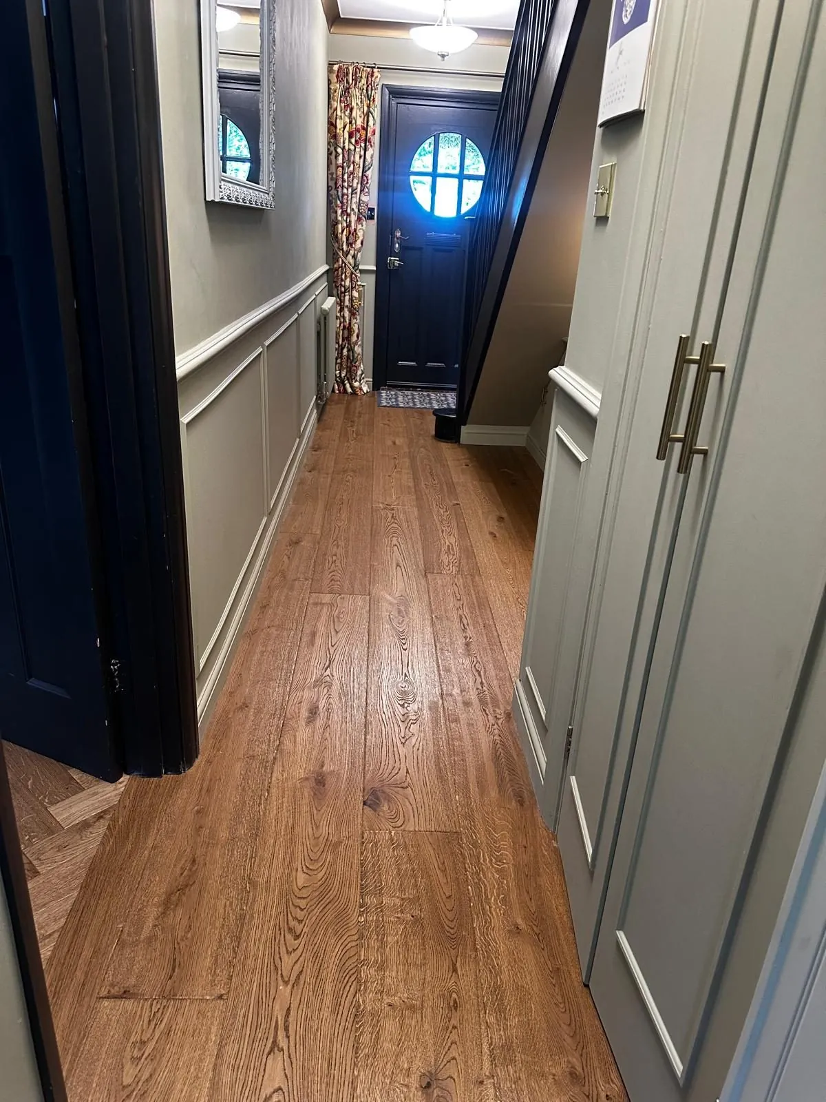Character oak planks fitted down a narrow hallway to the front door | Northfold Flooring