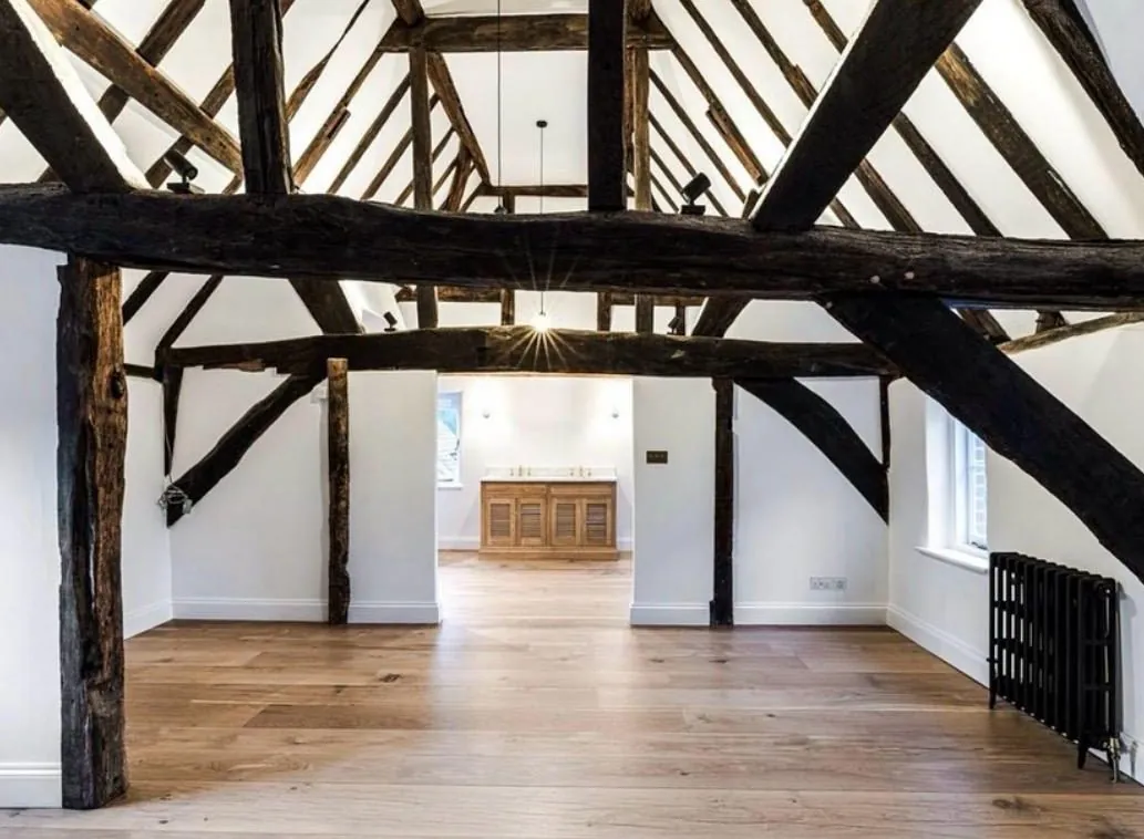 Wide plank oak flooring under exposed beams in a barn conversion | Northfold Flooring