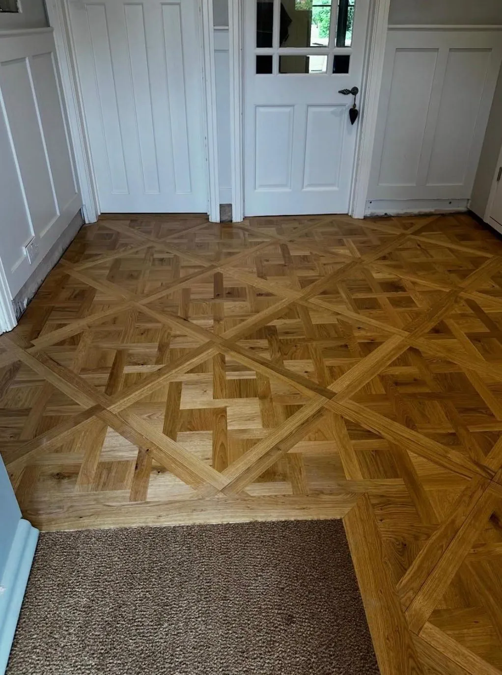 Versailles oak parquet floor by a cottage door | Northfold Flooring
