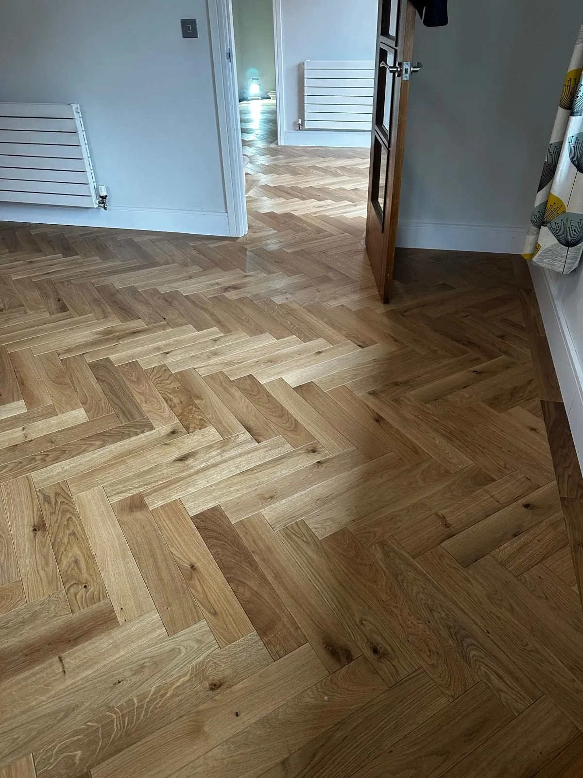 Herringbone oak flooring installed in a bedroom | Northfold Flooring